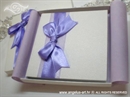 white hardcover greeting card with lilac bow