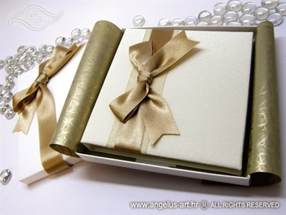 white hardcover greeting card with golden bow