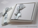 white hardcover greeting card with silver bow